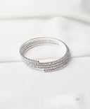 AYA Silver Coil Bangle With Clear Rhinestones
